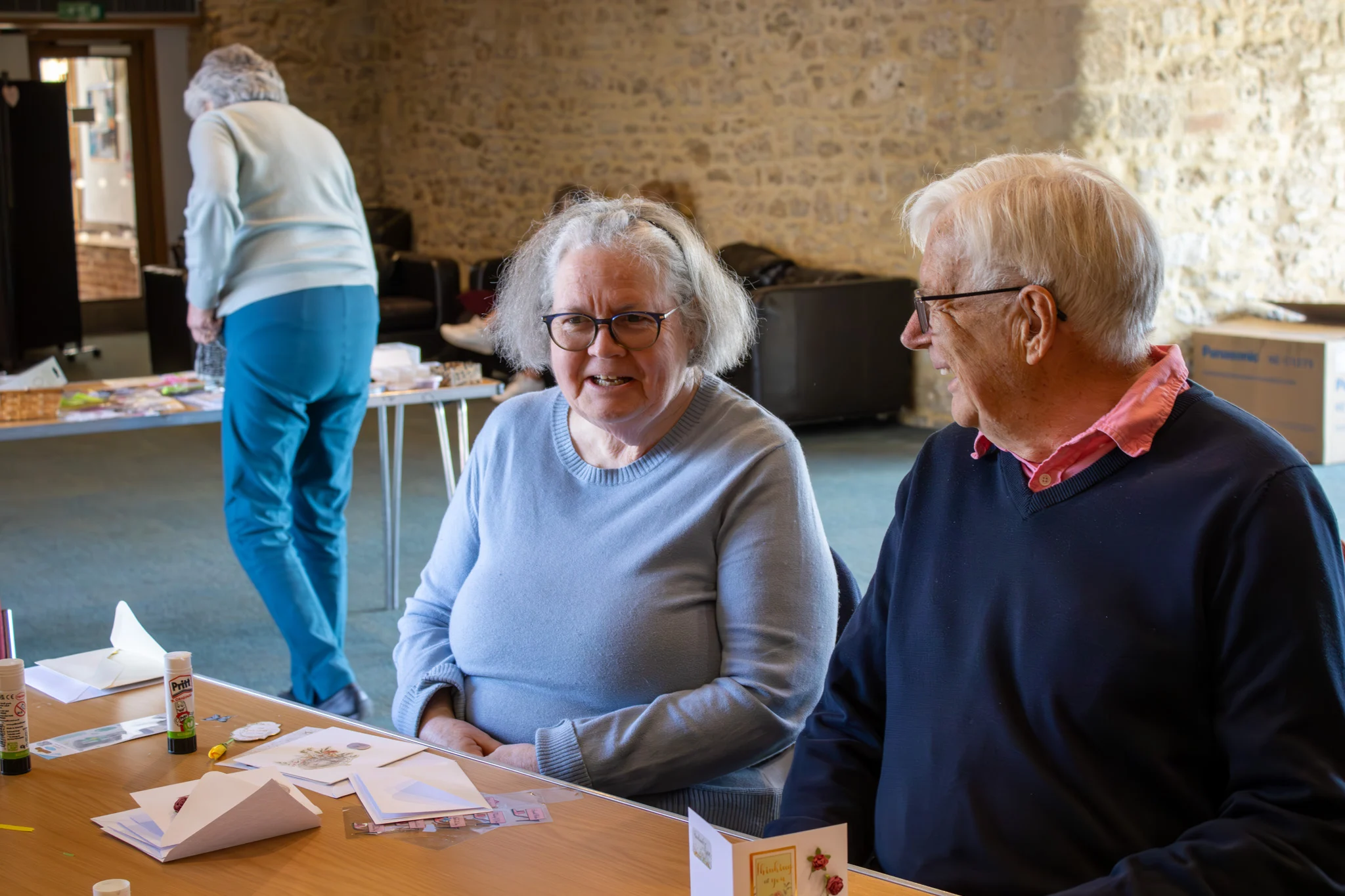 Members chatting around a table