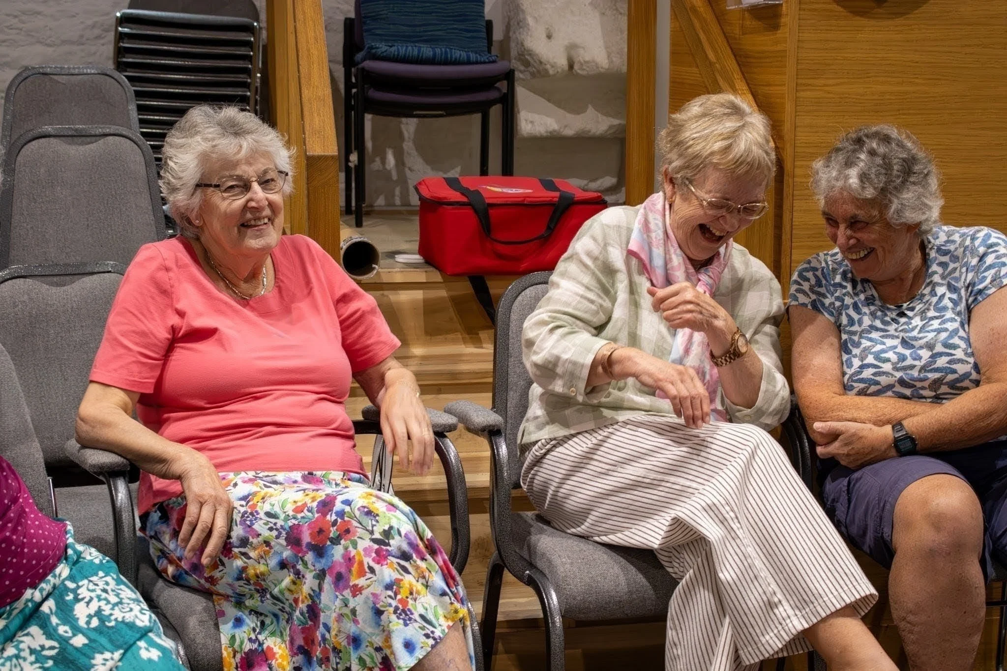Women laughing together in the church hall
